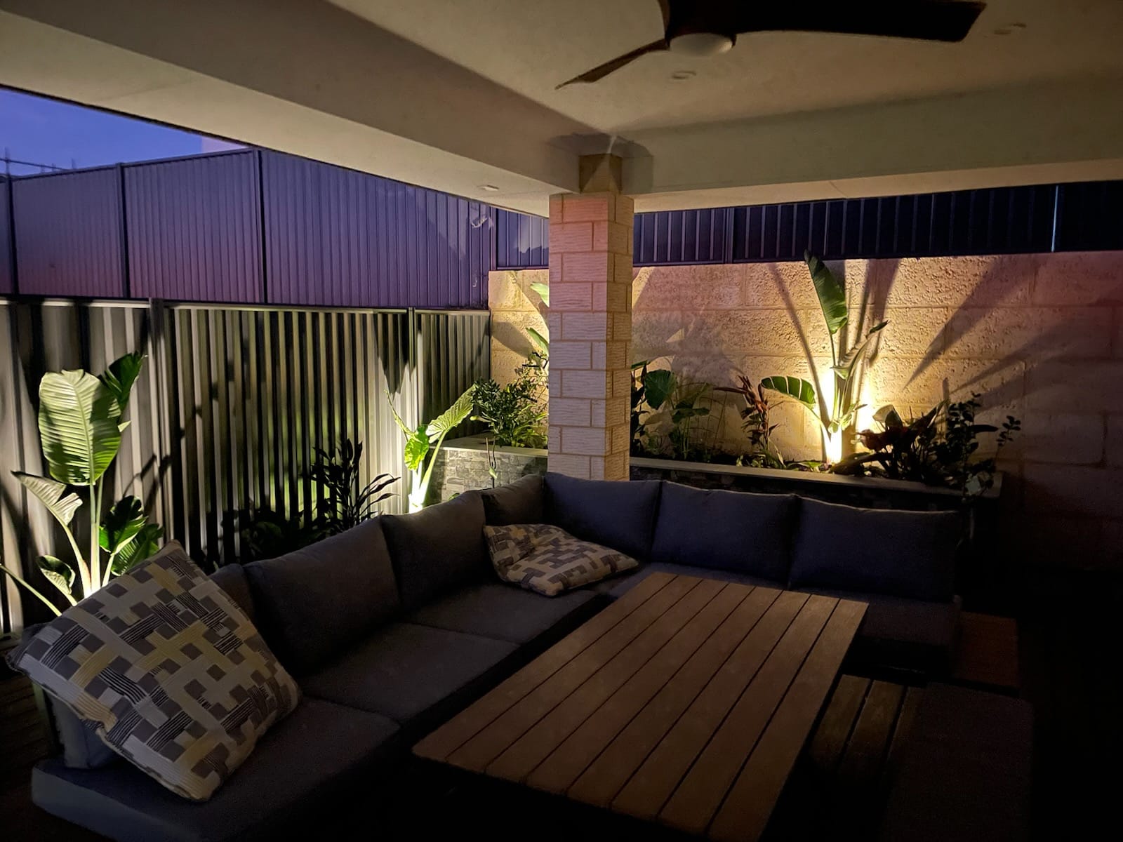 patio and outdoor seating lit up with garden lighting